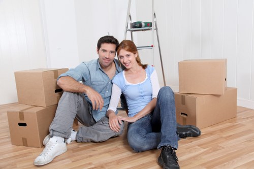 Packed boxes and furniture ready for transport by moving truck in Gipsy Hill