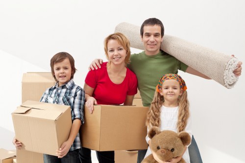 Packed moving boxes and furniture protection ready for collection
