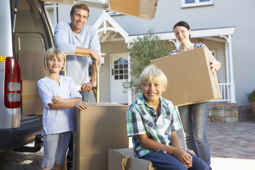 Loading furniture into a van on a South London residential street