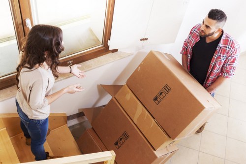 Packed boxes and household items ready for man with van transport