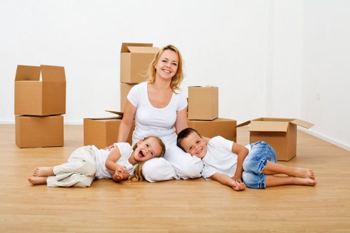 Packed boxes and furniture prepared for a flat move in South London